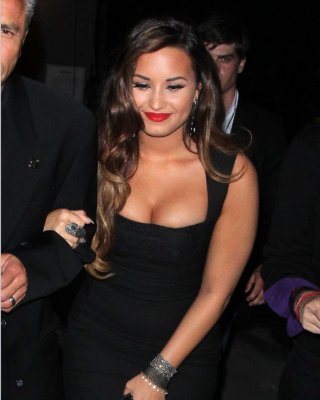 Demi Lovato shows huge cleavage in low cut black dress heading to MTV's VMA Pre  #75290123