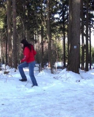 Dark Haired Babe Pisses In The Snow Outside