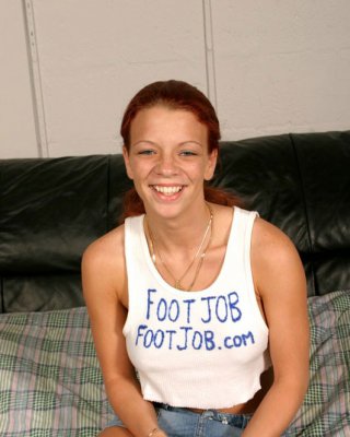 Sexy redhead with huge jugs rubbing him with her feet #76646836