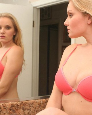 Lizzie shows off her perfect tits in the mirror as she strips out of her bra and panties #59030259