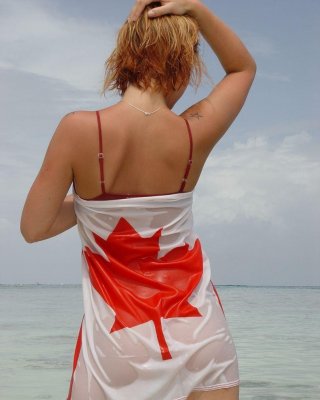 Pictures Of Teen Chick Lindsey Marshal Wrapped Up In A Canadian Flag On The Beac