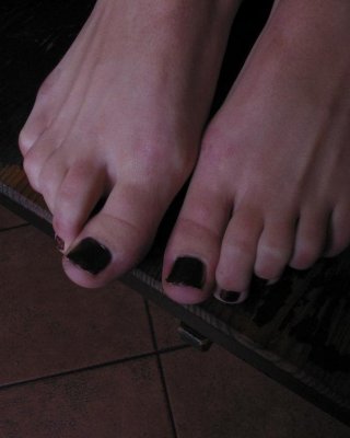 Brunette Girl Shows Off Her Pretty Feet On The Table At A Pub