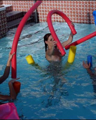 Lesbians Teens Play In A Pool