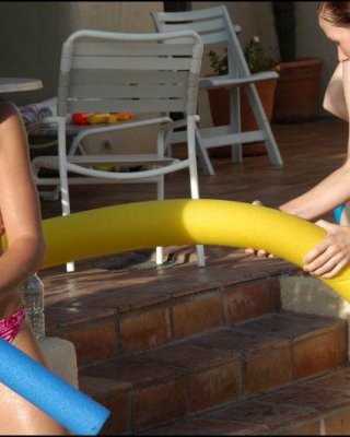 Lesbians Teens Play In A Pool