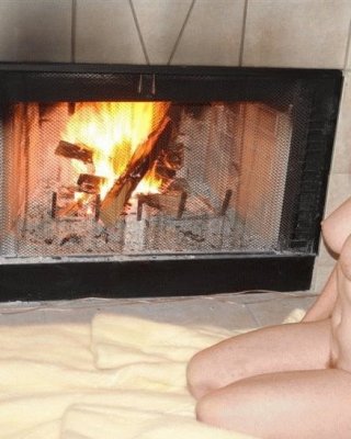 Romantic Matures In Front Of Fireplace