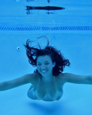 Enjoying Her Underwater Tits