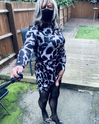 Kelly in leopard pattern dress black tights and heels #106913806