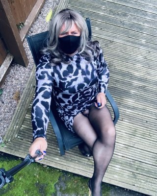 Kelly in leopard pattern dress black tights and heels #106913809