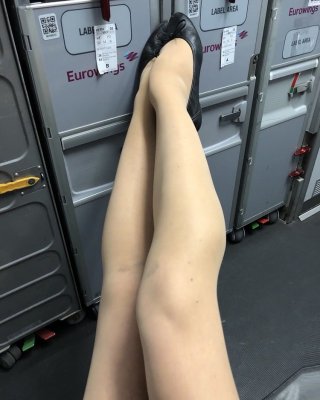 Sexy Stewardess In Heels And Stockings