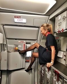 Sexy Stewardess In Heels And Stockings