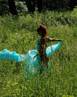 With a turquoise veil in the contrlight #107047395