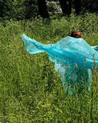 With a turquoise veil in the contrlight #107047397