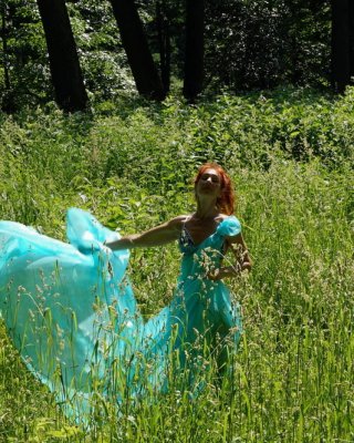With a turquoise veil in the contrlight #107047413