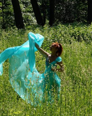 With a turquoise veil in the contrlight #107047415