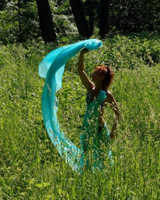 With a turquoise veil in the contrlight #107047425