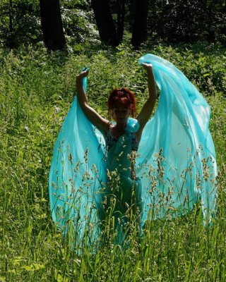 With a turquoise veil in the contrlight #107047429