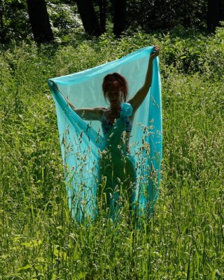 With a turquoise veil in the contrlight #107047438