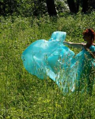 With a turquoise veil in the contrlight #107047442