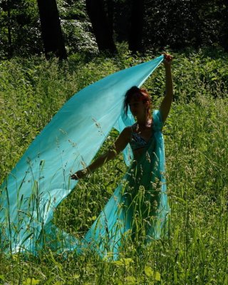 With a turquoise veil in the contrlight #107047458