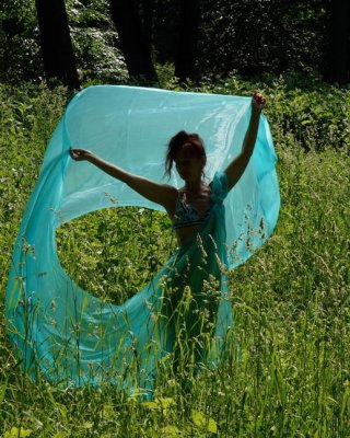 With a turquoise veil in the contrlight #107047460