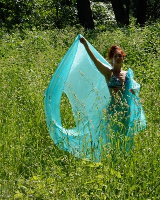 With a turquoise veil in the contrlight #107047464
